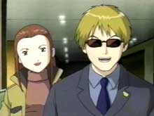 Yamaki and Riley during the D-Reaper crisis, discovering that Janyu has unearthed a copy of the original program